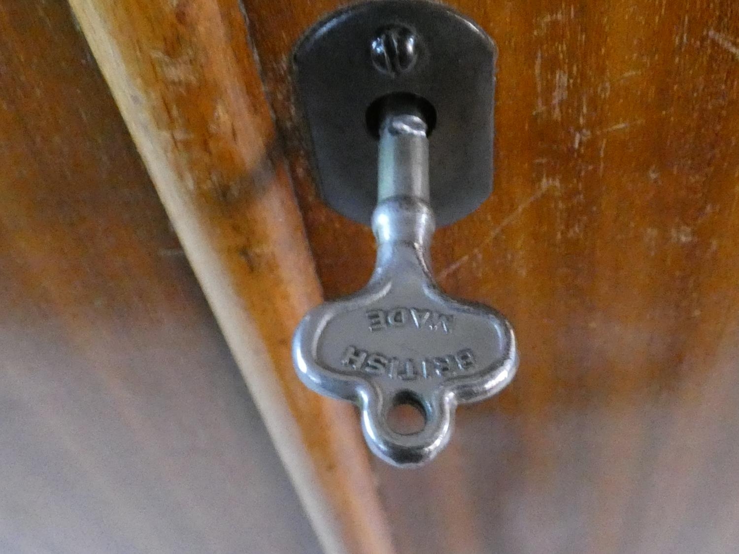 A 1960's fitted teak compactum wardrobe with inset Heal's disc to the inside of door. H.178 W.92 D. - Image 9 of 12