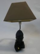 A resin Buddha's head contemporary desk lamp. H.35cm