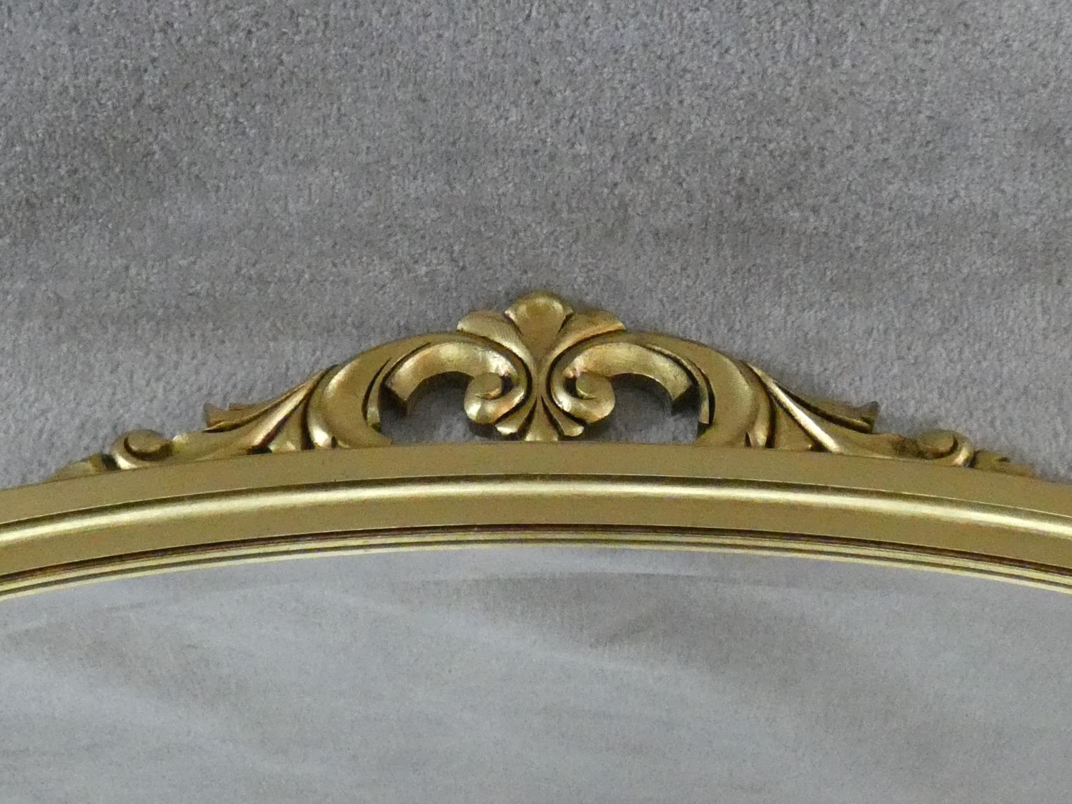 A Victorian style gilt framed overmantel mirror with scrolling foliate cresting. H.91 W.128cm - Image 3 of 4