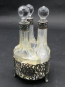 An antique pierced scrolling repousse design Dutch silver cruet set by Zaanlandse