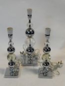A set of three chrome and bubble glass table lamp bases. H.50cm