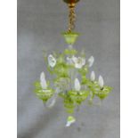 A Venetian glass six branch chandelier with flowerhead and leaf decoration. H.90 D.50cm