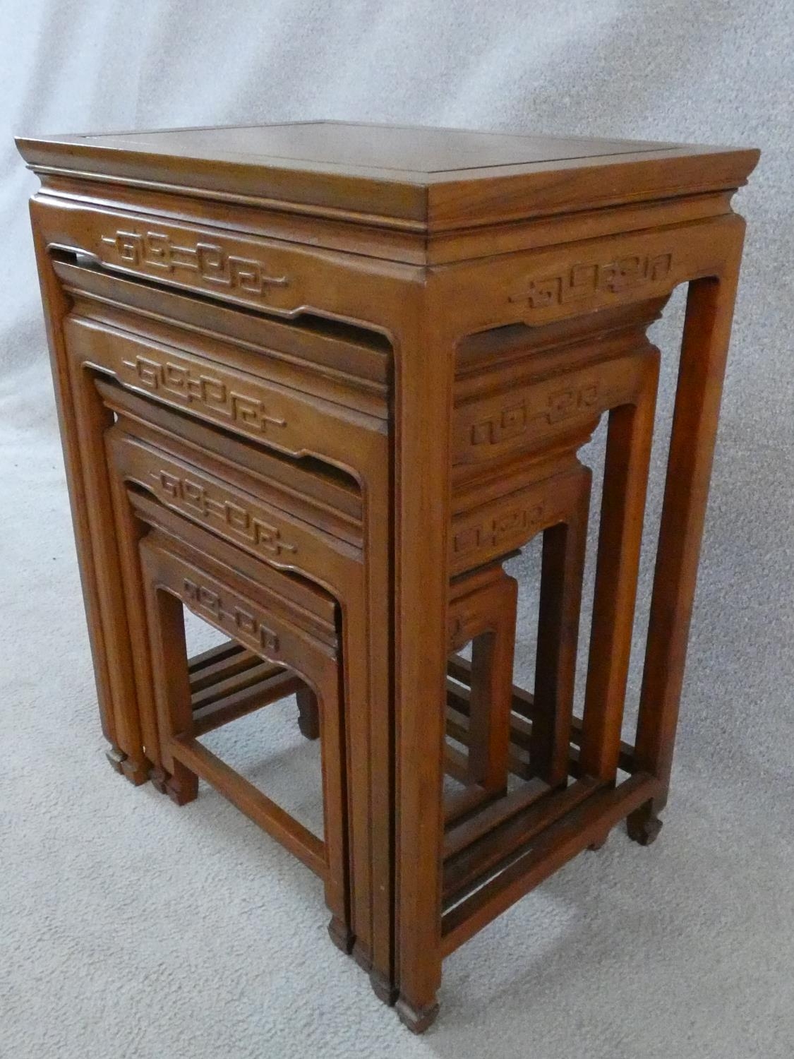 A nest of four Chinese hardwood graduating occasional tables with carved frieze on shaped - Image 21 of 22