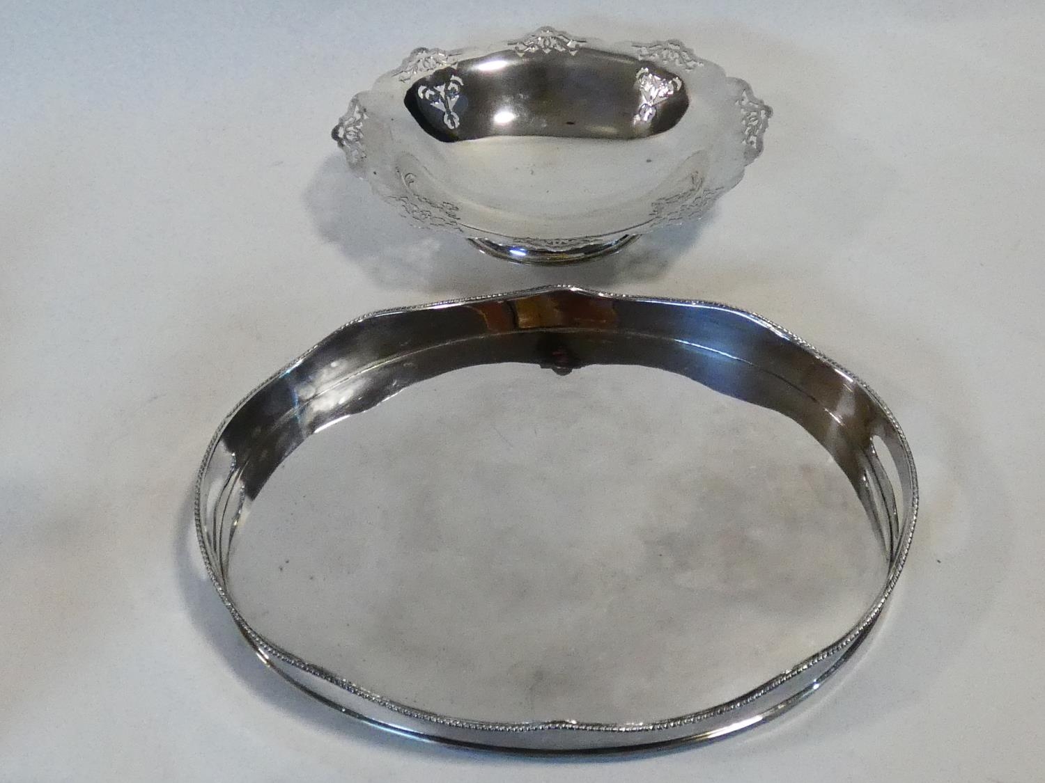 A silver plated twin handled galleried tray along with a silver plated comport with pierced