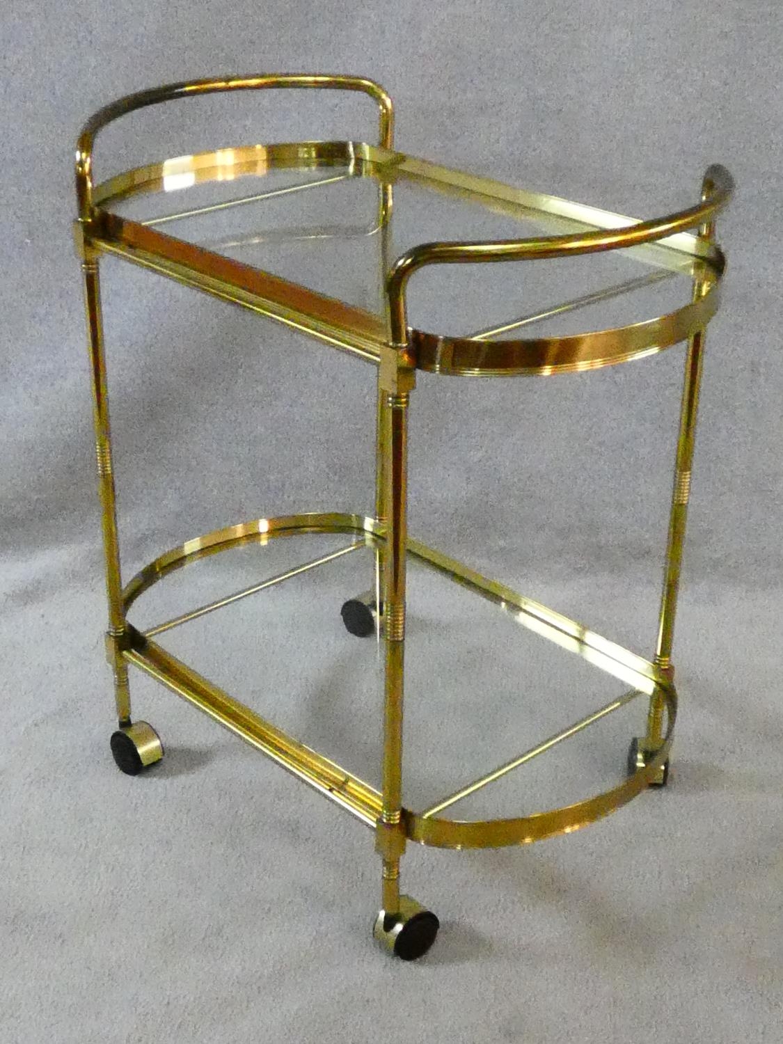 A vintage style brass serving trolley with two inset glass tiers. H.76 L.72 W.43cm - Image 3 of 16