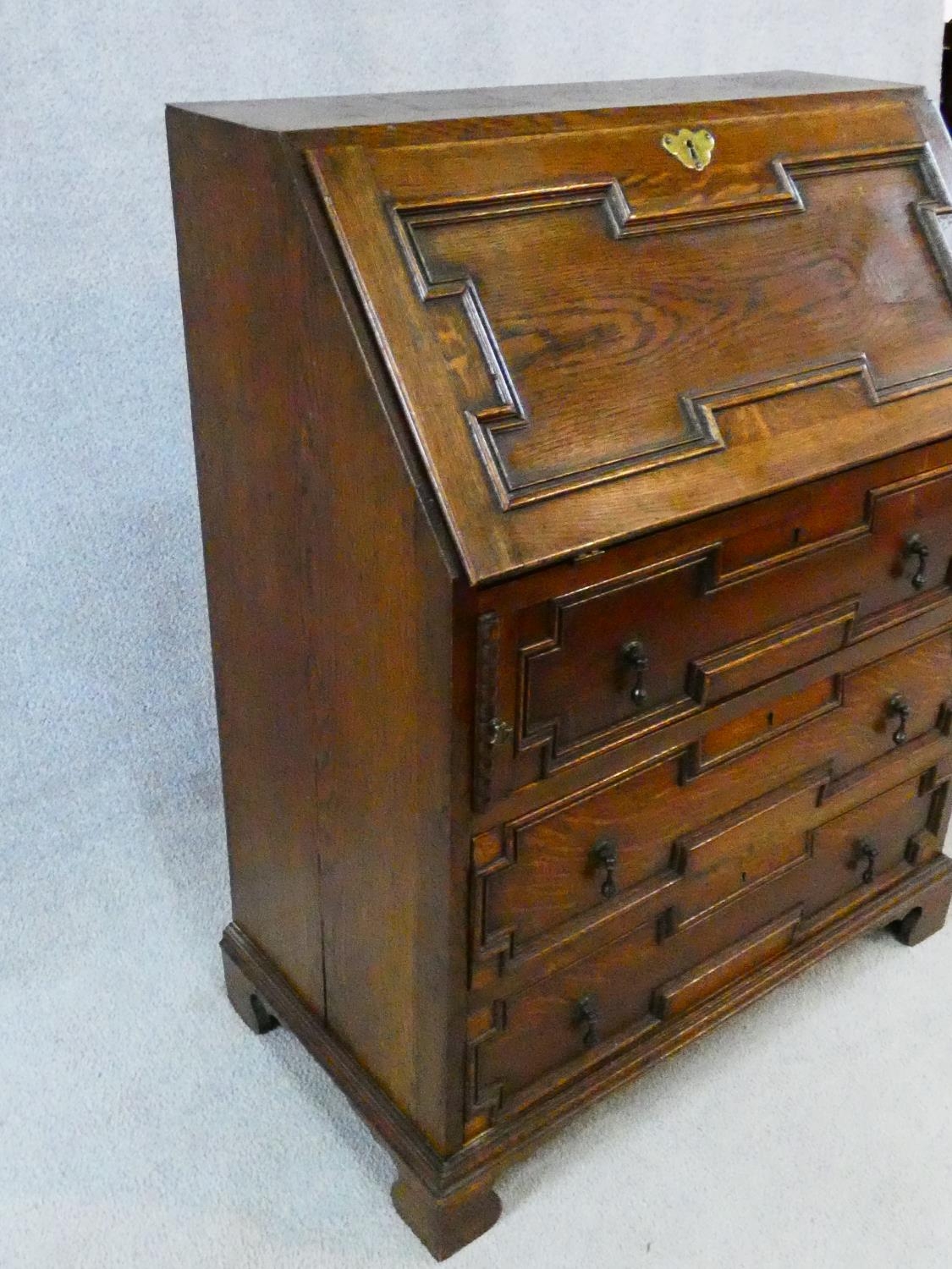 A mid century Jacobean style oak bureau with lozenge inset panels and fall front revealing fitted - Image 16 of 26