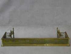 A 19th century pierced brass fender with kettle stand to each end. H.32 W.127 D.29cm