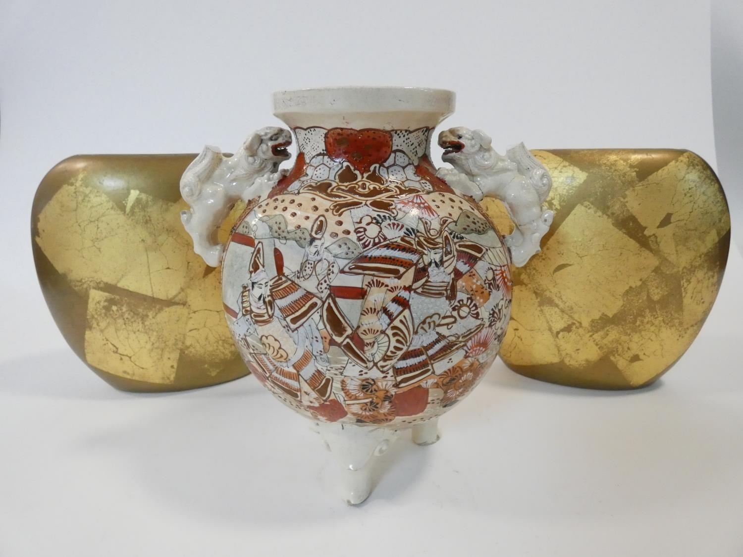 A vintage Satsuma ware lamp base with hand painted Japanese warriors and Foo dog handles, along