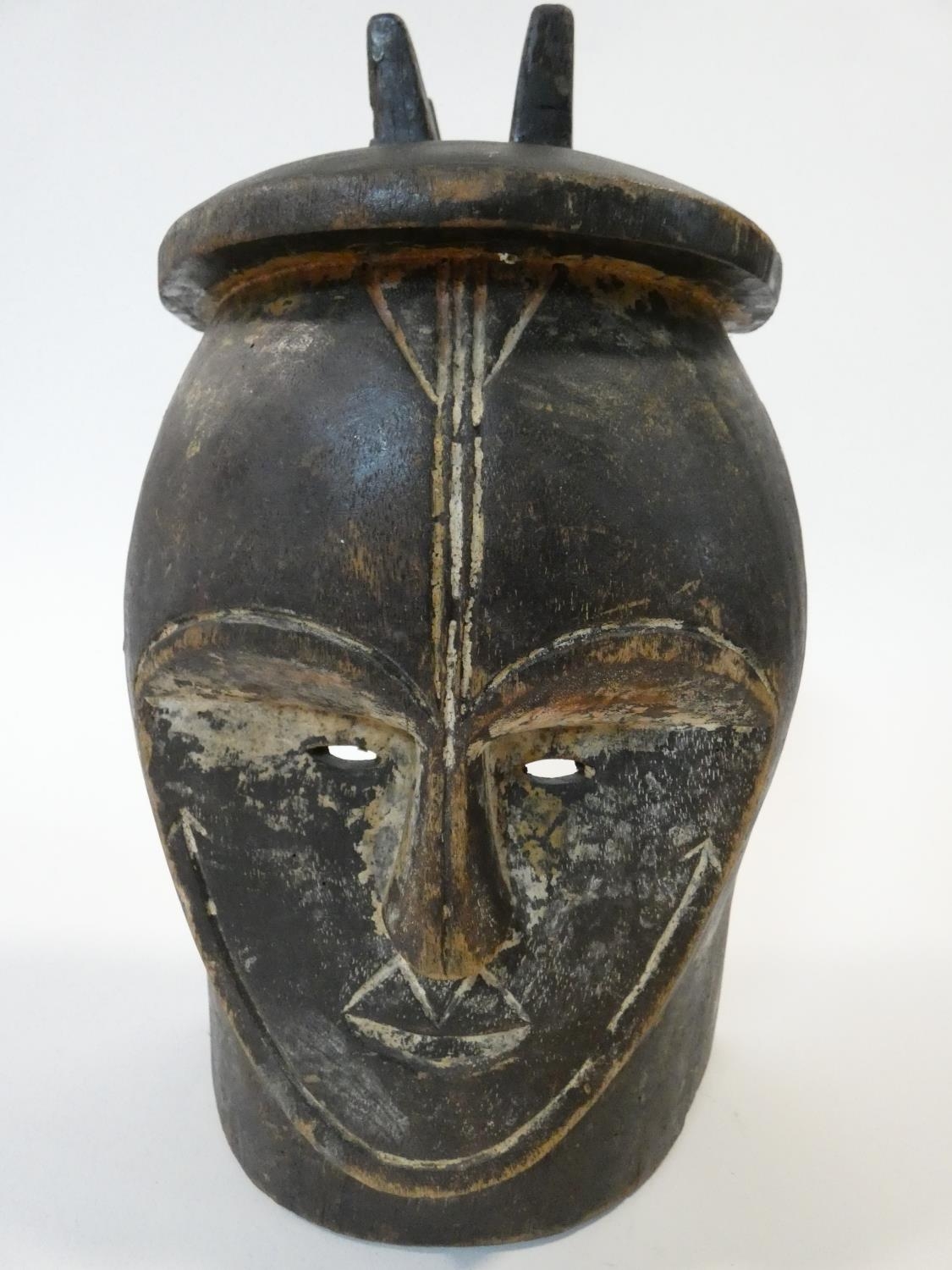 A carved wooden African tribal mask along with a carved wooden Chinese immortal and a ceramic figure - Image 2 of 11