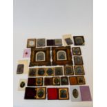 A collection of twenty five 19th century daguerreotypes and ambrotypes. Some with velvet lined