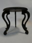 A small Indian hardwood occasional table with carved top and cabriole supports. H.30 D.30cm