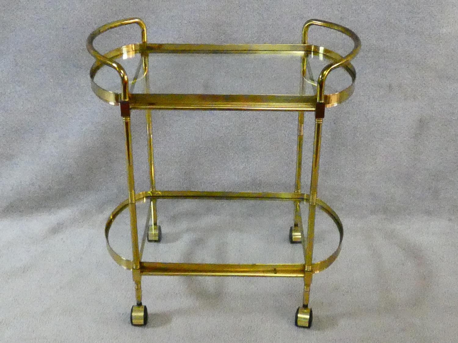 A vintage style brass serving trolley with two inset glass tiers. H.76 L.72 W.43cm - Image 2 of 16