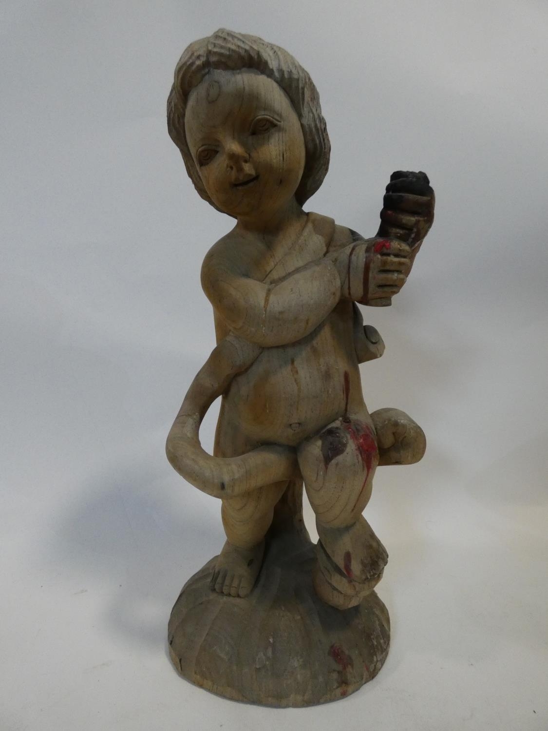 A painted Indonesian stick puppet and a carving of a child seated on a tree stump. H.51cm - Image 4 of 7