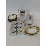 A Noritake coffee service for six with gilt and blue highlights along with a pair of floral gilt