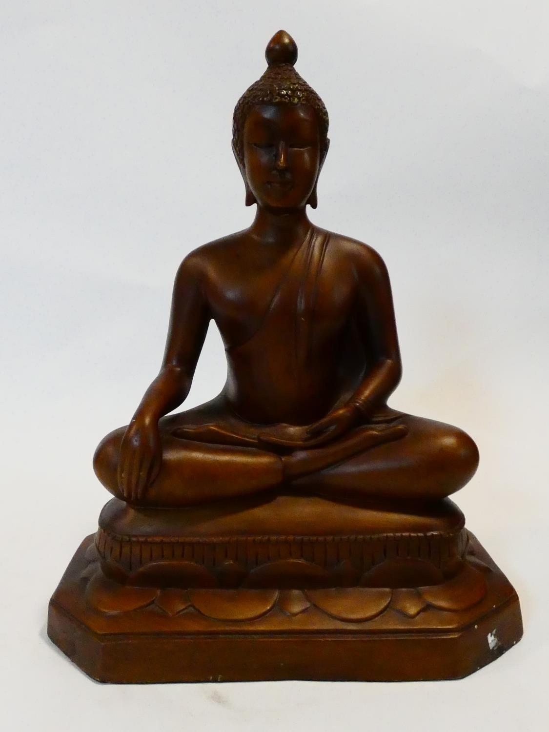 A gilded resin seated Buddha figure. H.41 W.32 L.20cm