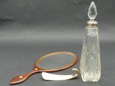 A bone inlaid dressing table mirror, a horn shoe horn and a silver collared star cut crystal