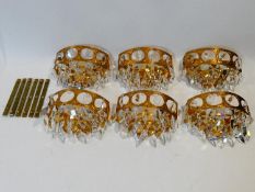 A set of six gilt metal wall lights with crystal drops. H.20cm