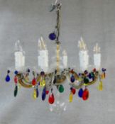 An eight branch glass framed ceiling chandelier with polychrome crystal drops. H.57 D.52cm