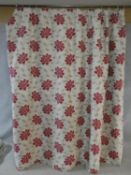 A pair of silk mixed lined curtains with stylised red floral design on a cream background. 223x175cm