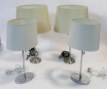 A pair of contemporary table lamps and their shades and a similar pair. H.59cm