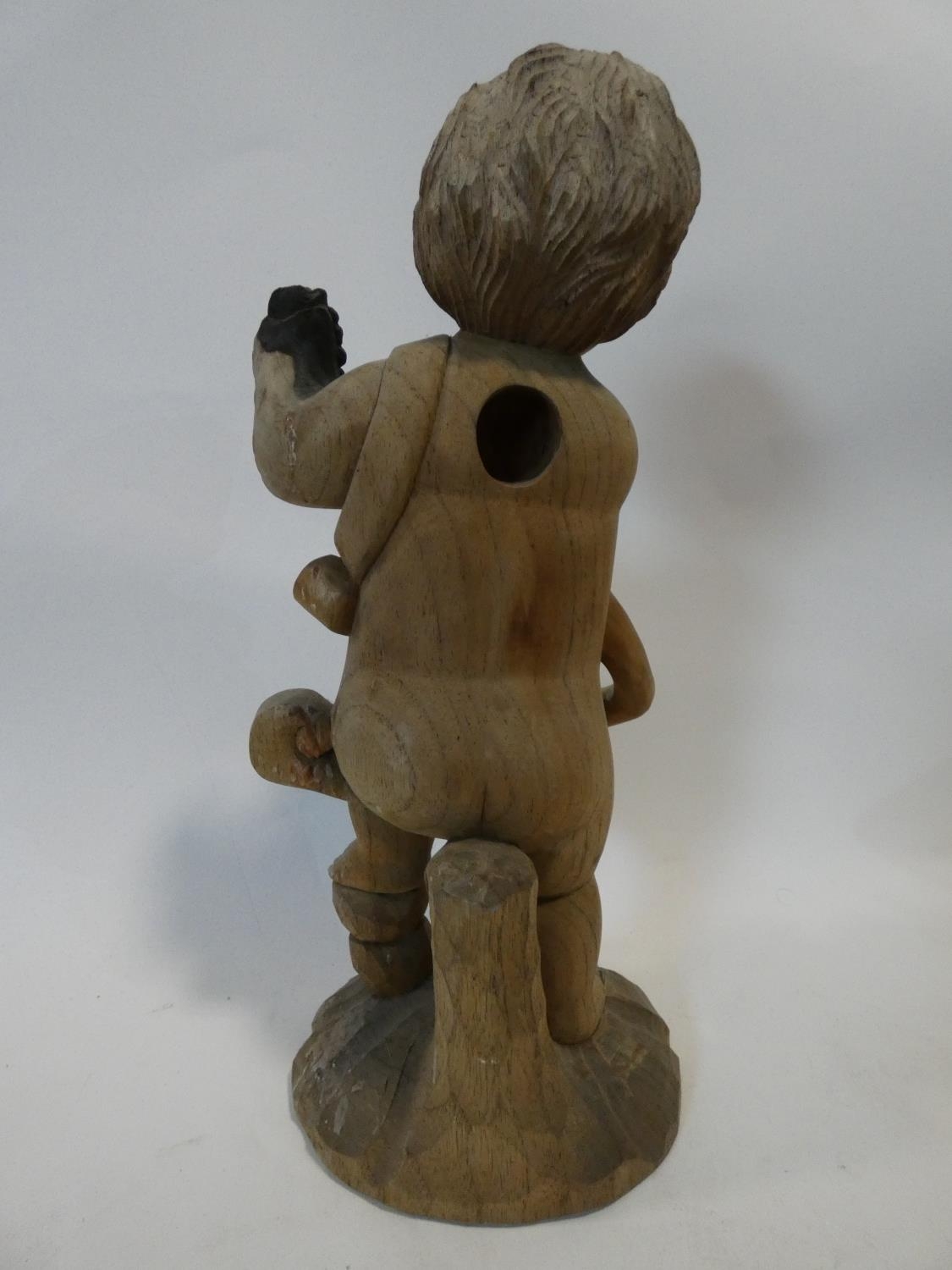 A painted Indonesian stick puppet and a carving of a child seated on a tree stump. H.51cm - Image 6 of 7