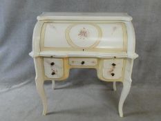 A Louis XV style painted cylinder bureau with roll top enclosing fitted interior and pull out