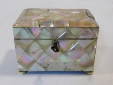 A small antique mother of pearl tea caddy, of rectangular form, the hinged lid revealing a mother of