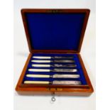 A late 19th century set of six Elkington plate dessert knives and forks with ivory handles and