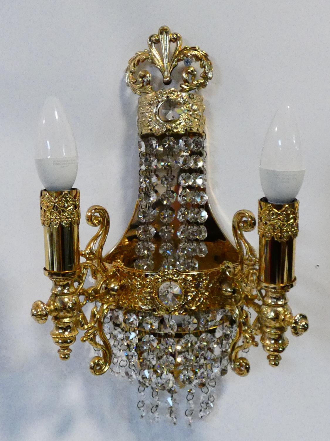 A set of six gilt metal twin branch wall candelabras with crystal drops. H.38cm - Image 2 of 9