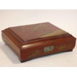 An antique Japanese lacquered fitted gaming box with hand painted gilt decoration depicting a