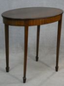 An Edwardian mahogany and satinwood strung occasional table on square tapering supports