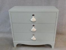 Nina Campbell, a contemporary Regency style straight front chest of three drawers on bracket feet