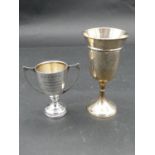 Two antique silver trophy cups. One with twin handles, hallmarked JG Ltd for Joseph Gloster Ltd,