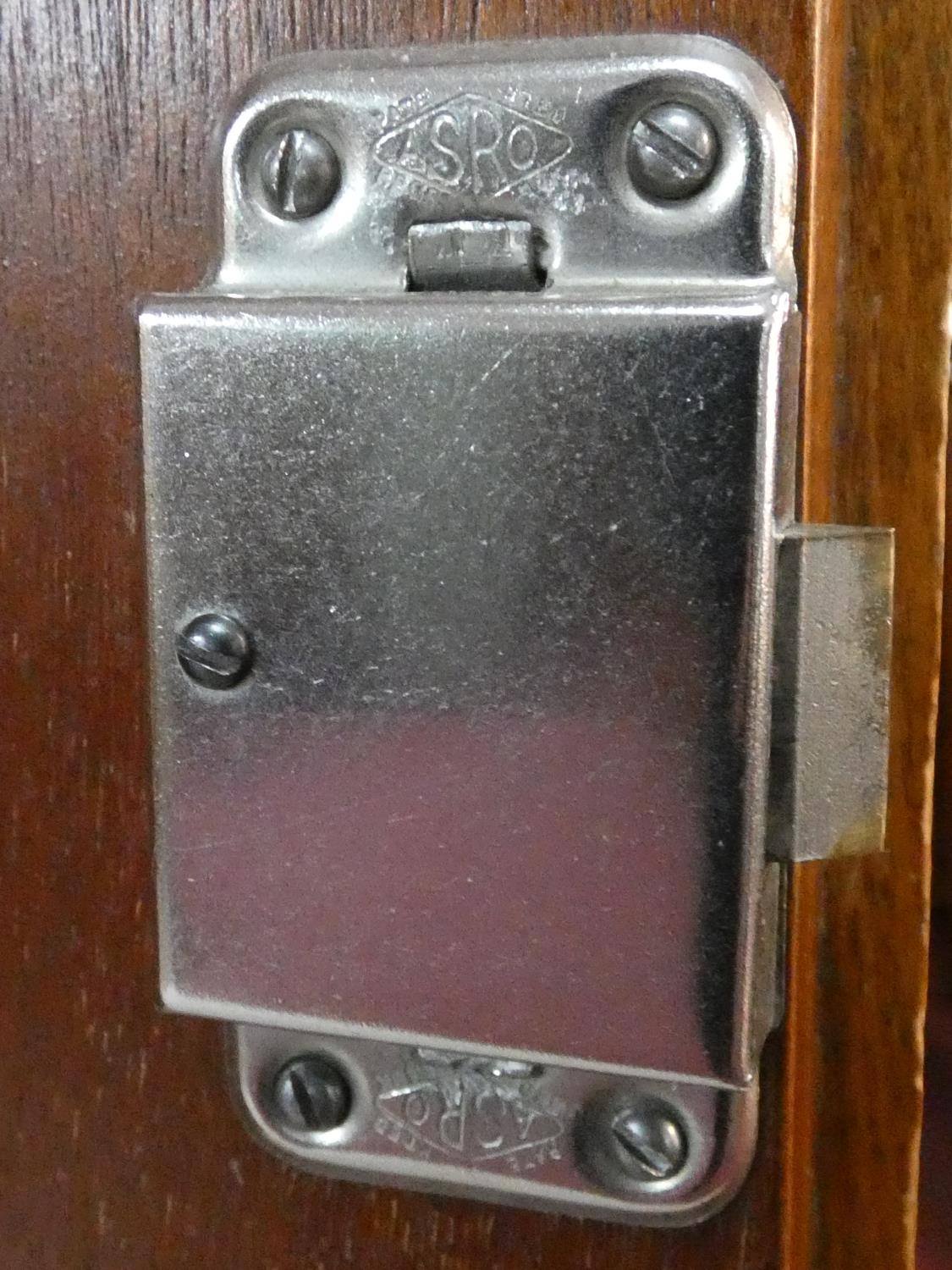 A 1960's fitted teak compactum wardrobe with inset Heal's disc to the inside of door. H.178 W.92 D. - Image 7 of 12