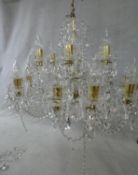 A large Czech crystal glass and brass mounted chandelier with eighteen twisted glass stem