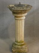 A sun dial on weathered classical column base. H.80 D.41cm