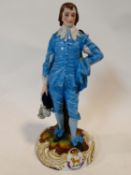 An antique Levy & Co porcelain hand painted figure of the blue boy based on Gainsborough's painting.