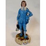 An antique Levy & Co porcelain hand painted figure of the blue boy based on Gainsborough's painting.
