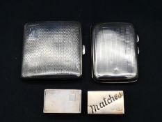 A collection of four silver tobacciana items. The two cigarette cases with engine turned