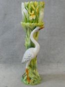 An Art Nouveau style Delphin Massier jardiniere on stand, heron and yellow flag iris, stamped D