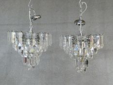 A pair of ceiling chandeliers with clear perspex lozenge form drops. H.60 D.40cm