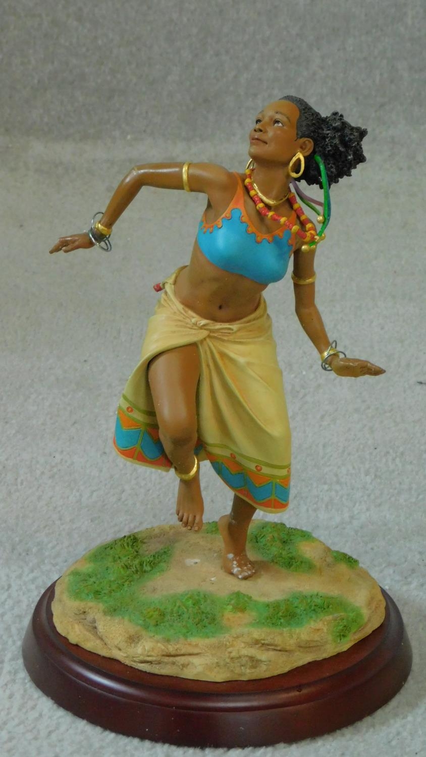 A boxed Thomas Blackshear Ebony Visions ?The Dancer? limited Edition hand painted figure mounted