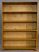 A light oak open bookcase. H.121 W.87 D.21cm