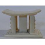 An early 20th century carved ivory African miniature headrest/ashanti stool. H.7xW.10xL.5cm
