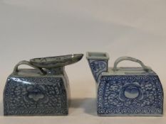 Two Chinese porcelain hand painted portable urinals with floral blue and white design. One