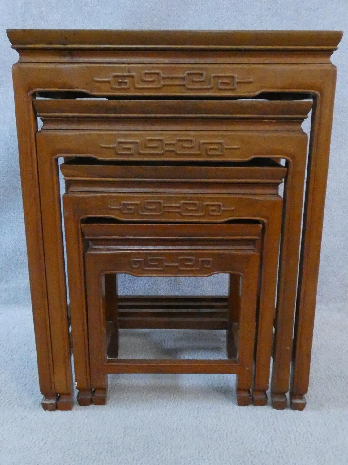 A nest of four Chinese hardwood graduating occasional tables with carved frieze on shaped - Image 14 of 22