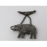 An Art Deco silver, marcasite and ruby novelty elephant brooch watch. Set with round mixed cut