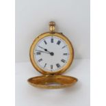 A 19th century ladies pocket watch in 18ct yellow gold, the half hunter case all over engraved