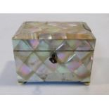 A small antique mother of pearl tea caddy, of rectangular form, the hinged lid revealing a mother of