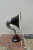 A table lamp converted from a 1920's gramaphone speaker in aluminium and bakelite. H.62cm